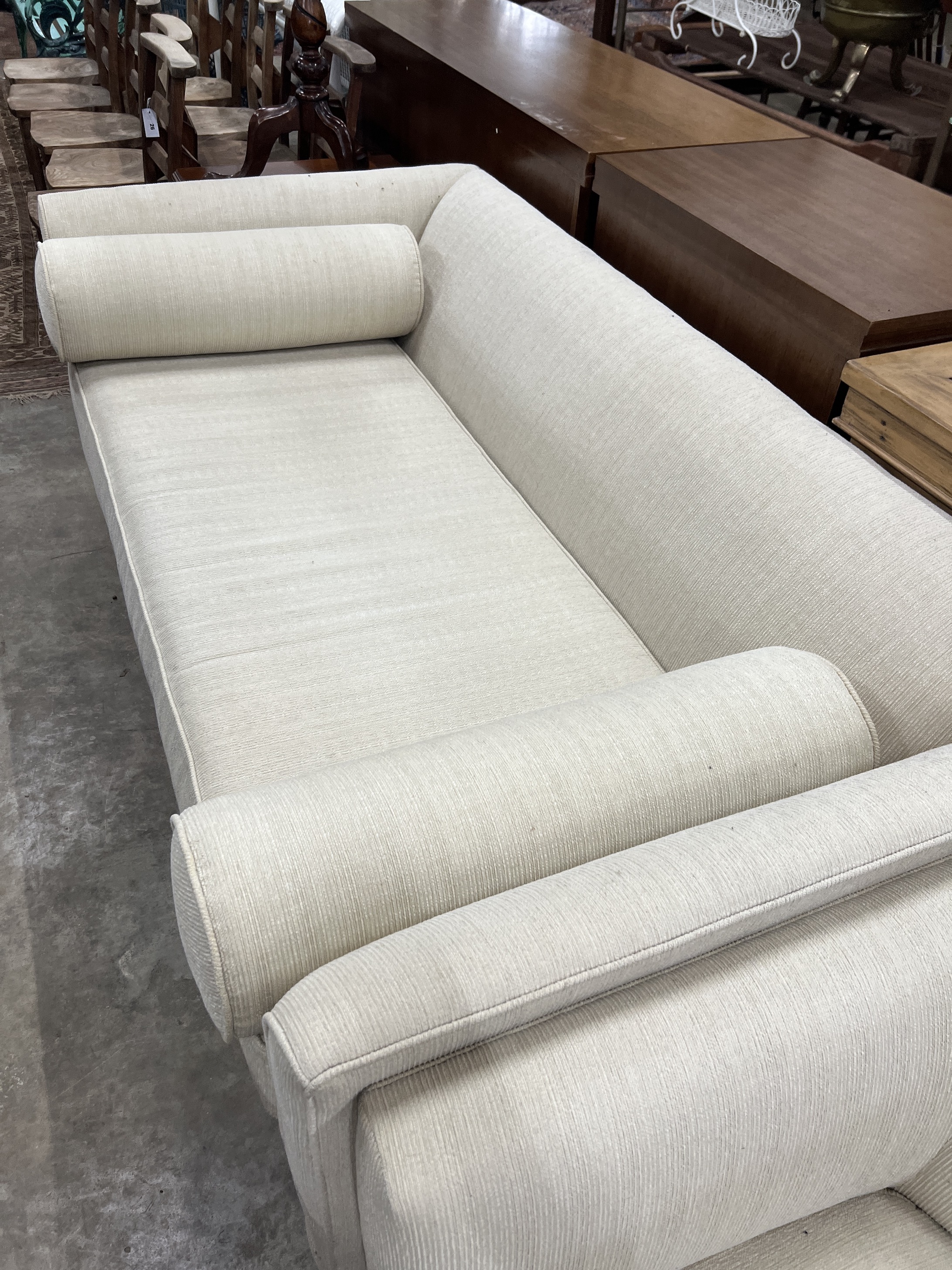 A contemporary three seater sofa, length 180cm, depth 91cm, height 72cm and similar tub armchair